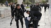 Al-Aqsa mosque: Israeli police fire rubber bullets at Jerusalem holy site in second night of violence