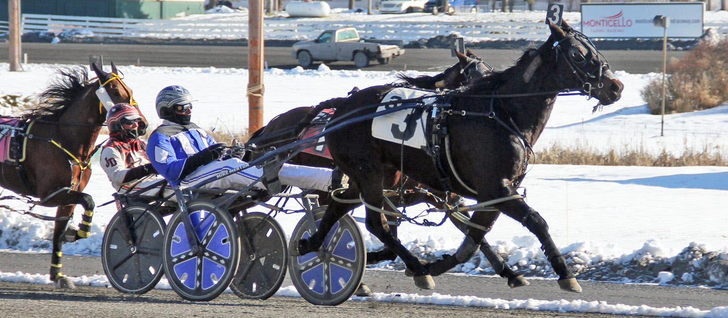 Michael Merton leads harness drivers at Monticello Raceway at midway point of season