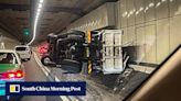 Truck topples over in tunnel heading to Hong Kong airport after slamming into wall