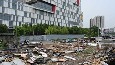 Stalls razed in New Town, but some hawkers return