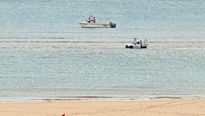 RNLI vehicle submerged by the sea at South West beach