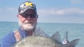 Northern Michigan fly fisherman breaks state record with 'monster' white perch