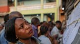 Congo votes for president as conflict and smudged ballots lead to fears election won't be credible