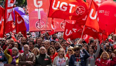 Workers around the world hold May Day rallies urging greater rights and more pay