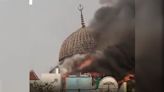 Moment giant dome of Jakarta mosque collapses during major fire