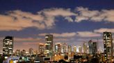Watch view of Tel Aviv skyline following Iran drone and missile attacks