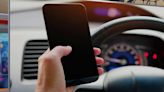 Can I text while stopped at a red light in Florida?