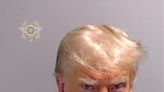 Trump posts scowling mugshot after arrest in first return to Twitter since Jan 6 ban – live