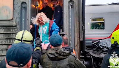 Rescuers pull injured passengers from train after derailment in northern Russia