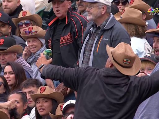 Fan ejected from Giants game for bizarrely tossing foul ball on field