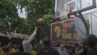 Prince Harry shows off basketball skills as Meghan watches on during visit to Nigeria