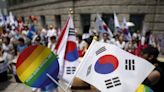 A South Korean mayor led hundreds of city officials to stop an annual pride festival but police intervened to protect organizers and allow the event to proceed