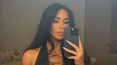 Kim Kardashian Reveals She's Actually Icing Her Back in Seductive Selfie: See Her Leather Look