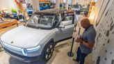 Electric vehicle maker Rivian: ‘We are not abandoning Georgia’ after pause in plant build