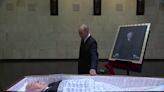 Vladimir Putin lays flowers next to Mikhail Gorbachev’s open coffin