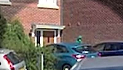 Moment figure paces outside house raided after Southport attack