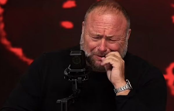 Conspiracy theorist Alex Jones breaks down sobbing on Infowars show claiming feds are trying to shutter show