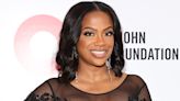Kandi Burruss Glows in a Puff-Sleeve White Cutout Dress for a Night Out with Todd Tucker