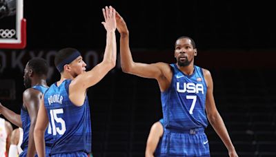 Booker and Durant receive Olympics jerseys from Grant Hill