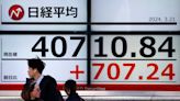 Stocks in Asia rise, yen wobbles after volatile start to week