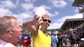 Machine Gun Kelly storms off after bizarre ‘air guitar’ exchange with Martin Brundle on F1 grid