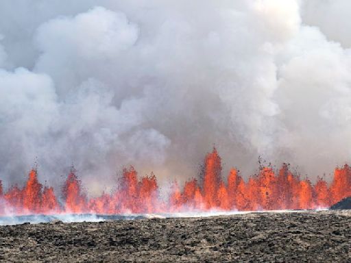 Iceland volcano dramatically erupts again as streams of lava reach town’s defensive walls