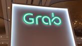 Grab lifts revenue forecast, delivery business breaks even