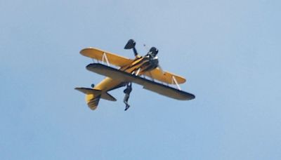 Terrifying moment Tom Cruise, 62, hangs off plane in death-defying stunt