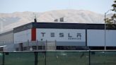 Tesla slides on widening delivery and production gap, demand worries