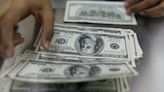 Dollar firm before key inflation test; yen limps towards BOJ meeting