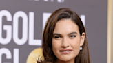 Lily James Radiates in Red Ruffled Cutout Ball Gown at the Golden Globes