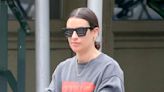 Lea Michele Goes Sporty-Chic In Graphic Crewneck With Sleek Leggings & New Balance Sneakers