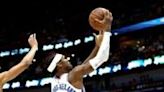 ...Shai Gilgeous-Alexander of the Oklahoma City Thunder shoots over CJ McCollum in the Thunder's victory over the New Orleans Pelicans in game three of their...