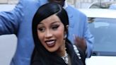 Cardi B covers up her curves in black floaty dress