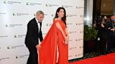 George Clooney fixes wife Amal Clooney’s dress on red carpet at awards ceremony