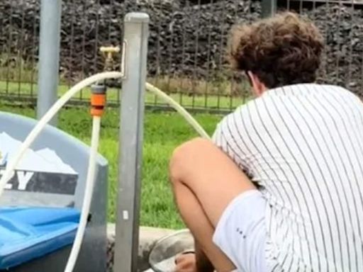 Why this photo of a camper washing his dishes has Aussies gagging