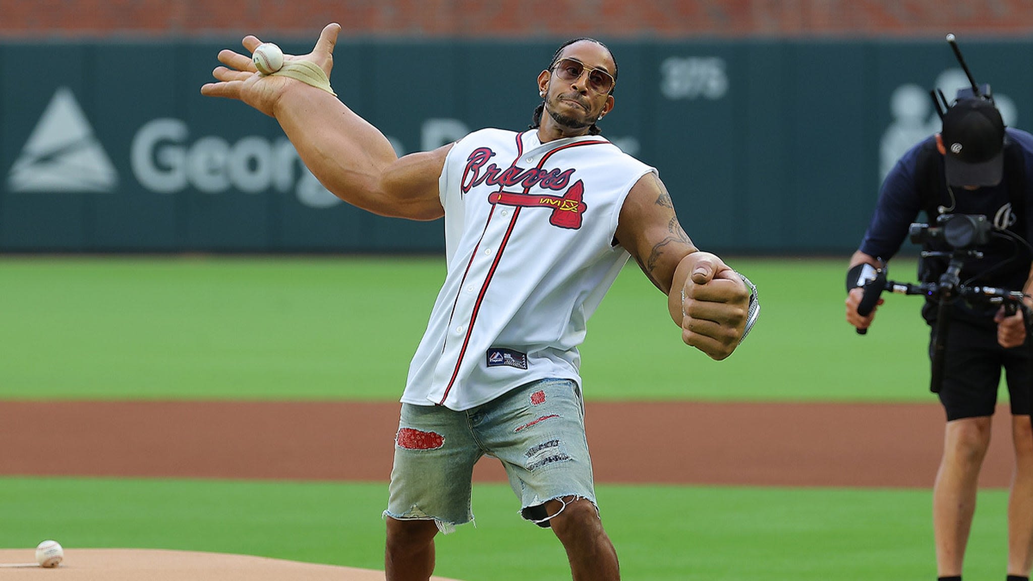 Ludacris Rocks Big Arms For First Pitch At Braves Game