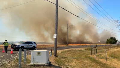 Brush fire near Green Hill Road under control; evacuation orders downgraded