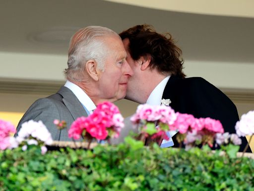 King Charles Kisses the Cheeks of Queen Camilla’s Son Tom Parker Bowles at Royal Ascot