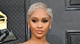 Saweetie Makes Outfit Switch Into Dramatic Black Dress With Crystal Cup & Sandals at Grammy Awards 2022