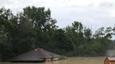 Teenage Girl and Dog Rescued After Hours Stranded on Roof By Kentucky Flood