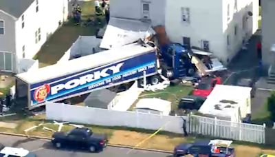 Tractor-trailer crashes into homes in Carteret after driver suffers medical episode