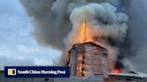 ‘National disaster’: fire topples spire at Copenhagen’s historic stock exchange