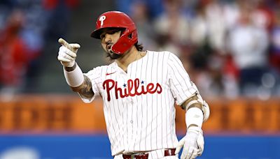 Castellanos homers as the Phillies beat the Cubs 9-6 and clinch first-round bye in playoffs