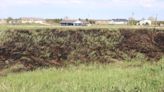 Grass fire extinguished near transfer station at Lake Maloney