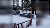 See helpless drivers in cars sliding and colliding on snowy street in the California