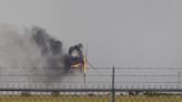 Flaming wind turbine falls to pieces after being struck by lightning