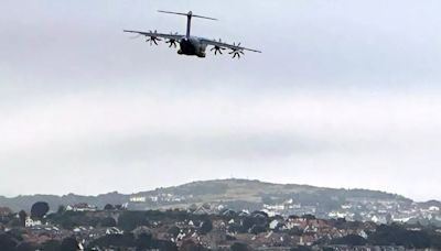 Giant military plane carrying soldiers terrifies people flying low over Wales with cargo door open