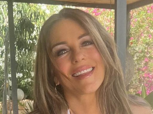 Elizabeth Hurley shows off her jaw-dropping figure in white bikini