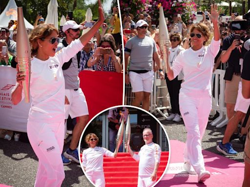 Energized Halle Berry walks Olympic torch down Croisette during Cannes Lions festival